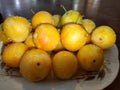 ripe cherry plum fruits collected in a heap in close-up