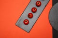 Ripe cherry tomatoes composed on black slate boards on colorful background Royalty Free Stock Photo