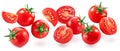 Ripe cherry tomatoes and tomatoes slices levitating in air on white background