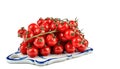 Ripe cherry tomatoes on a vine, three bunches on a white isolated background, space for text Royalty Free Stock Photo