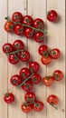 Ripe cherry tomatoes on a wooden table, Royalty Free Stock Photo