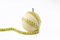 Ripe chinese pear with tailor measuring tape Royalty Free Stock Photo