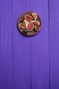 Tasty and ripe chopped figs on a purple wooden surface