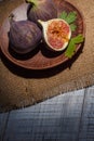 Ripe chopped figs on a white wooden surface