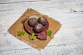 Ripe chopped figs on a white wooden surface