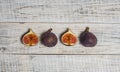 Ripe chopped figs on a white wooden surface