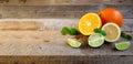 Ripe Citrus Fruit on the Old Wooden Table. Orange, Lime, Lemon Mint. Healthy Food. Summer Background. Royalty Free Stock Photo