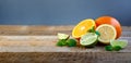 Ripe Citrus Fruit on the Old Wooden Table. Orange, Lime, Lemon Mint. Healthy Food. Summer Background. Royalty Free Stock Photo