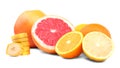 Ripe citruses isolated on a bright white background. Sour grapefruits and lemons. Nutritious banana pieces. Vitamin C.