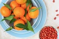 Ripe clementines and red skin pinuts Royalty Free Stock Photo