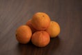 Ripe clementines on walnut wood table