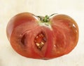 Ripe coeur de boeuf tomato cut through Royalty Free Stock Photo