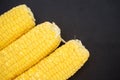 Ripe corn on a black background