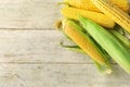 Ripe corn cobs on wooden background Royalty Free Stock Photo