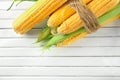 Ripe corn cobs on wooden background Royalty Free Stock Photo