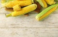 Ripe corn cobs on wooden background Royalty Free Stock Photo