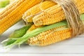 Ripe corn cobs on wooden background, closeup Royalty Free Stock Photo