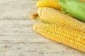 Ripe corn cobs on wooden background, closeup Royalty Free Stock Photo