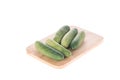 Ripe cucumber on chopping board white background Royalty Free Stock Photo