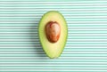 Ripe cut avocado on color background Royalty Free Stock Photo