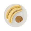 Ripe cut banana and a portion of peanut butter