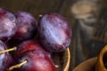 Ripe delicious plums of dark color