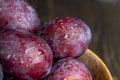 Ripe delicious plums of dark color