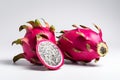 Ripe dragon fruit, pitaya or pitahaya on white background, fruit healthy concept. Tropical fruits, whole and sliced dragon fruit. Royalty Free Stock Photo