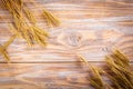 Wheat Ears on the Wooden Table. Sheaf of Wheat over Wood Background. Harvest concept Royalty Free Stock Photo