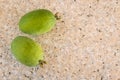 Ripe feijoa fruit on marble kitchen bench with copy space on right Royalty Free Stock Photo