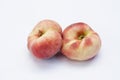 Ripe flat Chinese peaches on the white isolatd background