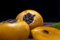 Ripe fragrant sweet persimmons laid out on old wooden boards