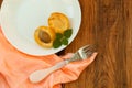 Ripe fresh apricot fruits on a white plate on the wooden background. Copy space, delisious healthy food Royalty Free Stock Photo