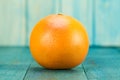 ripe fresh grapefruit on a blue wooden background. Royalty Free Stock Photo