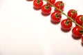 Ripe fresh Juicy organic cherry tomatoes closeup on branch isolated on a white background Royalty Free Stock Photo