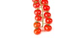 Ripe fresh Juicy organic cherry tomatoes closeup on branch isolated on a white background Royalty Free Stock Photo