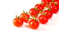 Ripe fresh Juicy organic cherry tomatoes closeup on branch isolated on a white background Royalty Free Stock Photo