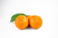 Ripe fresh juicy tangerines with leaves on white background