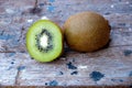 Ripe fresh kiwi fruits and half sliced