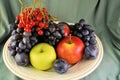 Fresh organic ripe fruits apples grape plums berries natural gourmet product dessert background