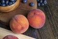 Ripe fresh peaches on a wooden table Royalty Free Stock Photo