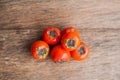 Ripe fresh persimmon on wood board. Food ingredient.