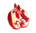 Ripe fresh pomegranate half with juicy seeds on white