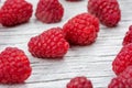 Ripe fresh raspberries on a wooden background