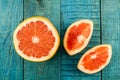 Ripe fresh sliced grapefruit on wooden background Royalty Free Stock Photo