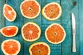 Ripe fresh sliced grapefruit on wooden background Royalty Free Stock Photo