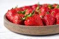 Ripe fresh strawberries in a gray ceramic plate close-up Royalty Free Stock Photo