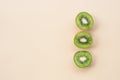 Ripe, fresh, sweet, healthy, tasty peeled kiwi on a pastel background. Flat lay, top view, food concept