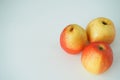 Ripe fruit. Two pears and an apple on a white background. Royalty Free Stock Photo