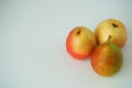 Ripe fruit. Two pears and an apple on a white background. Royalty Free Stock Photo